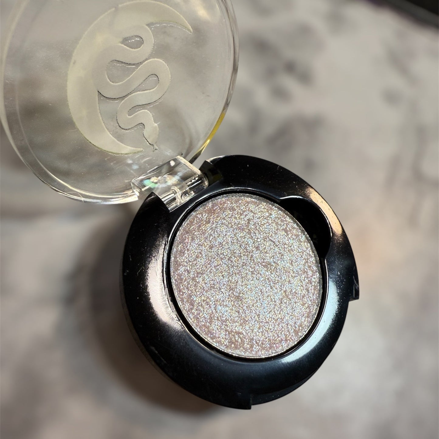 black eyeshadow compact, with sparkly white eyeshadow