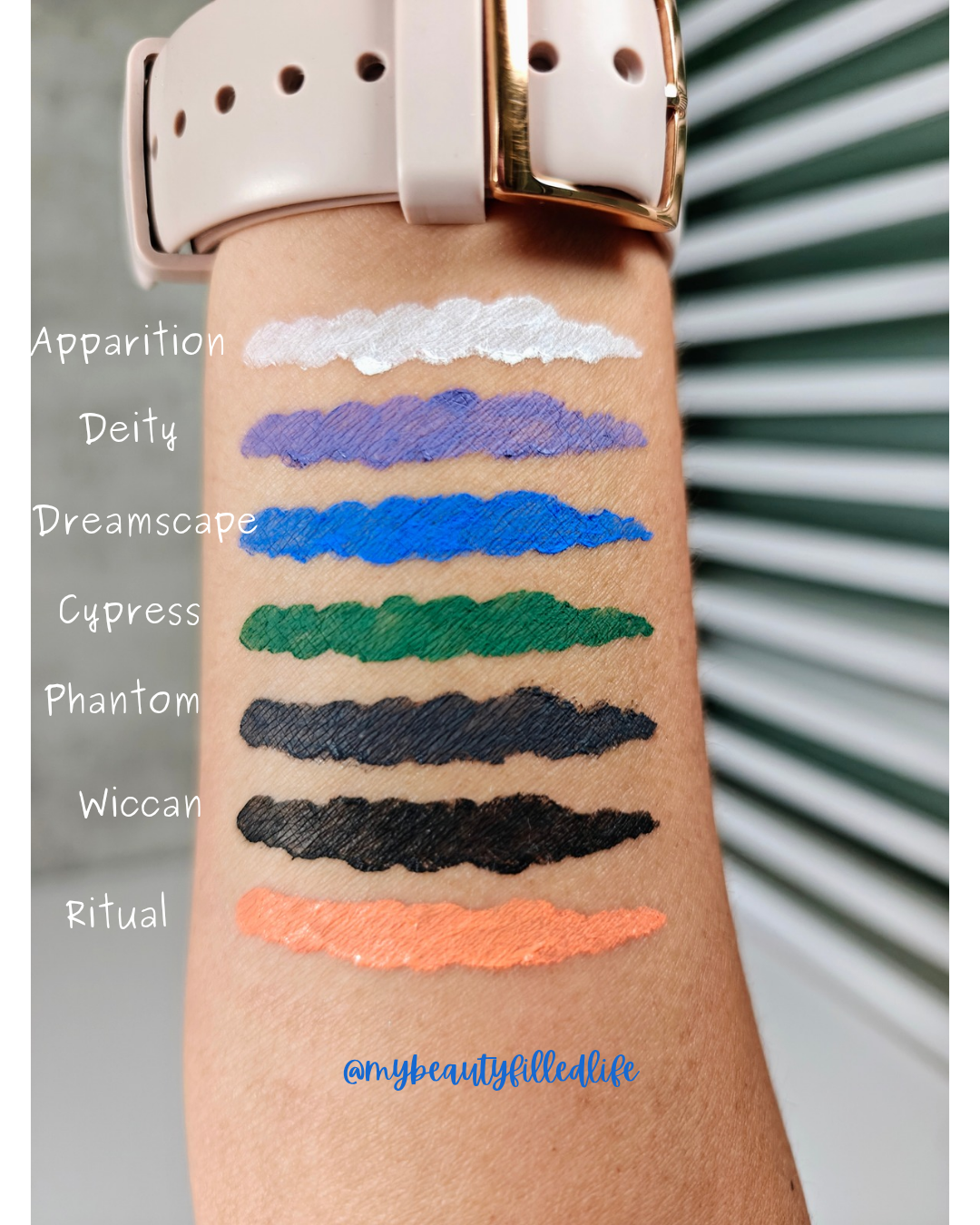 eyeliner swatches on a medium skin tone arm, labeled with shade names to the left