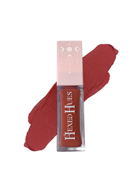 Terracotta red hexed hue blush tube, with color swatch behind it on a white background