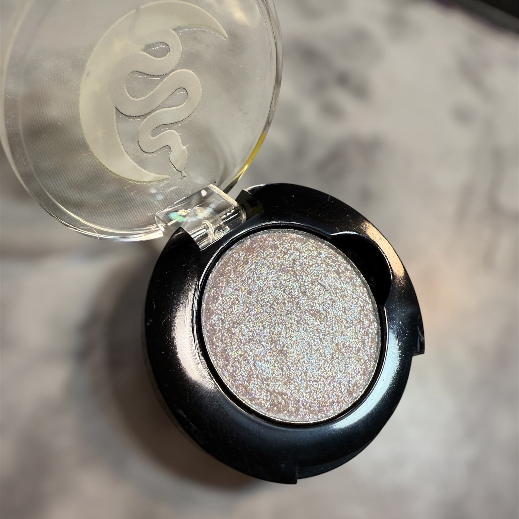 black eyeshadow compact, with sparkly white eyeshadow